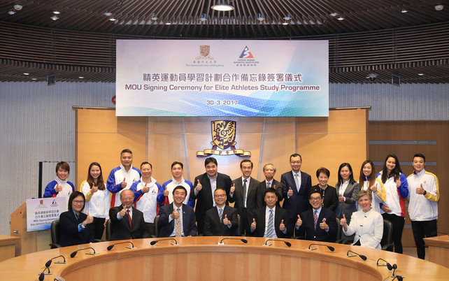 The guests pose for a group photo at the MOU signing ceremony.